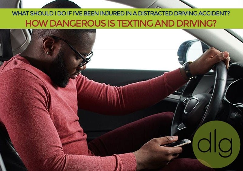 A man sits in a car driver's seat looking at his phone, with text about injuries from distracted driving and the dangers of texting while driving.