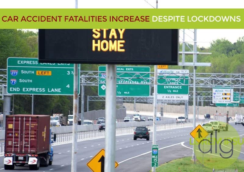 A highway scene with multiple road signs, vehicles, and an overhead sign reading "STAY HOME"; text above notes a rise in car accident fatalities despite lockdowns.