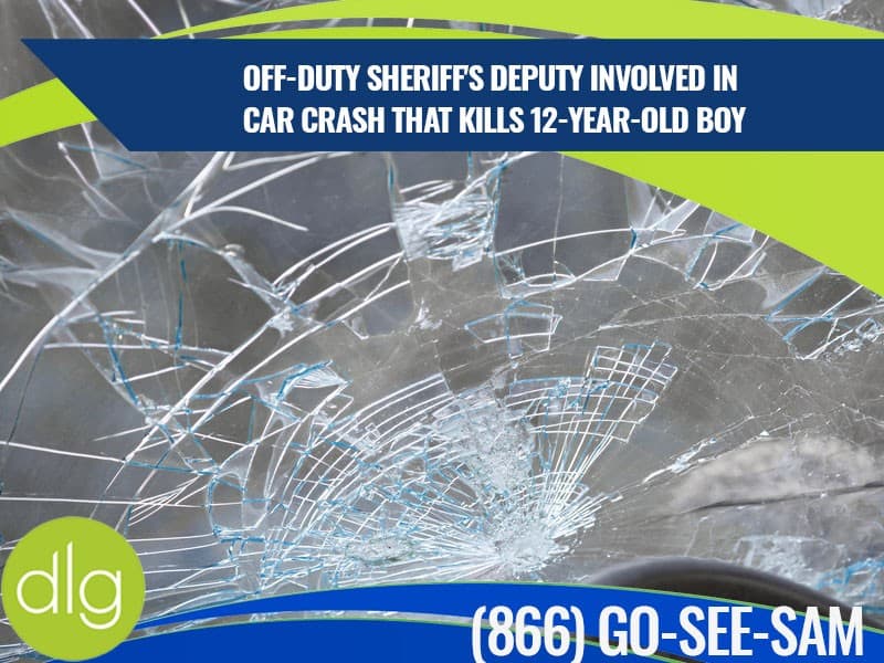 Close-up of a shattered car windshield with a news headline about an off-duty sheriff’s deputy involved in a fatal crash that killed a 12-year-old boy.
