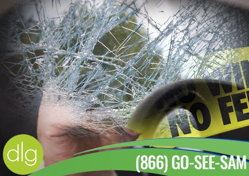 A close-up of a shattered car window with police tape and a green banner displaying the phone number (866) GO-SEE-SAM and the dlg logo.